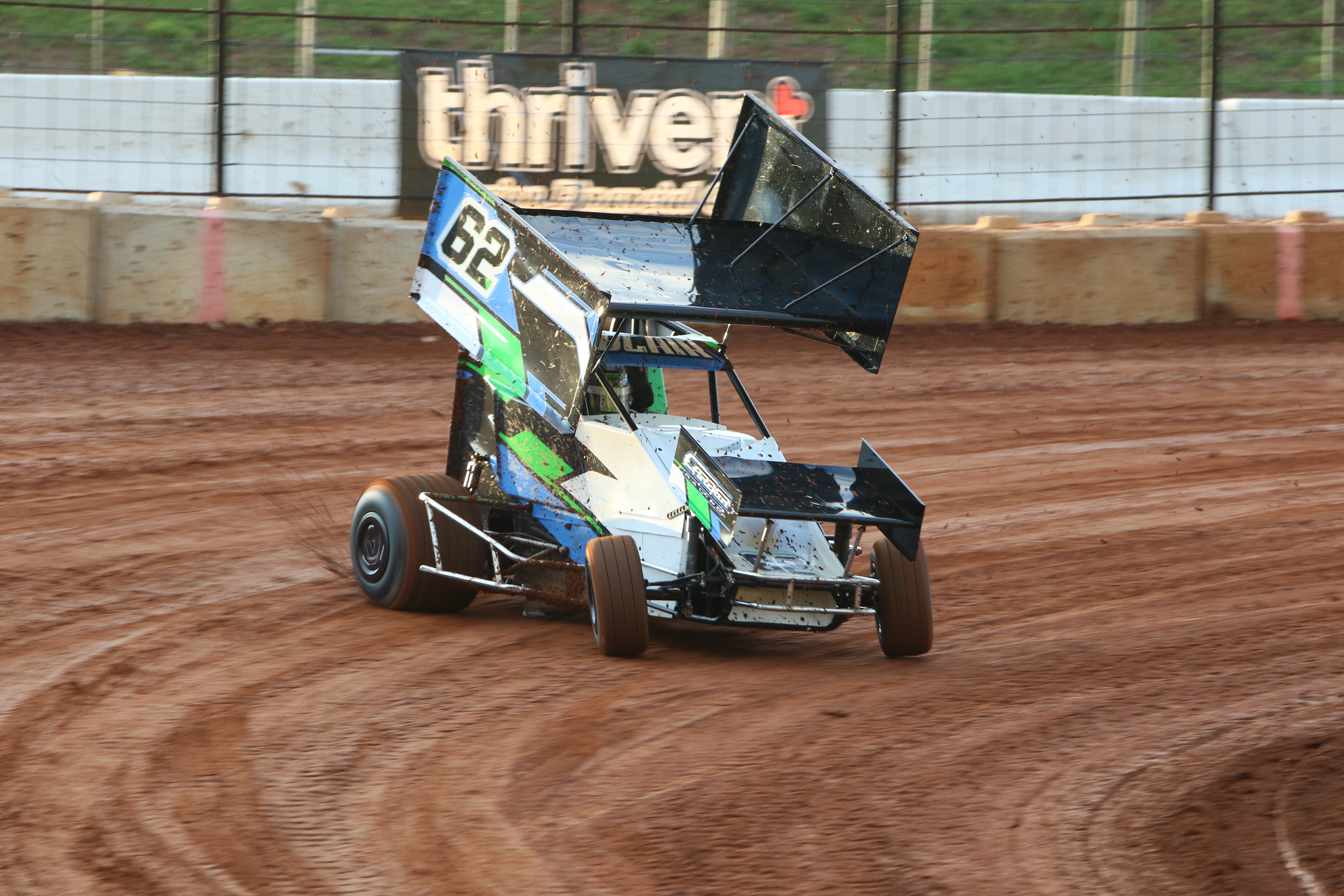 Sprint car racing around a dirt track